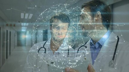 Doctors tapping tablet in hospital corridor, emerging rotating network sphere while analyzing nodes - Powered by Adobe