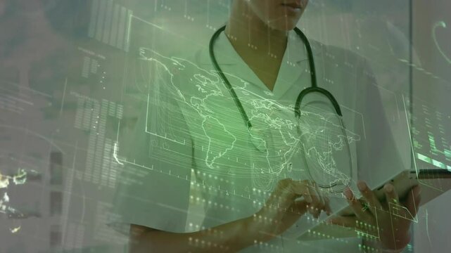 Female doctor tapping tablet in clinic, generating holographic world map and reviewing patient data