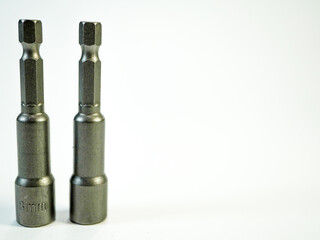Two socket wrench attachments illustrate equipment and tool accessories for construction and repair...