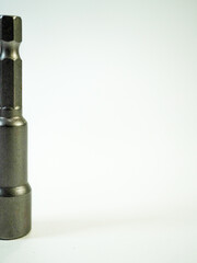 Close up view features a metal nut driver bit against a clean white background, perfect for...