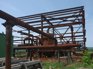 Rusty steampunk pipes on abandoned powerplant