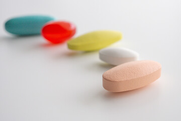 Colorful medicine pills tablet on white background