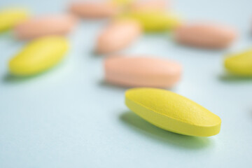 Colorful medicine pills tablet on blue background