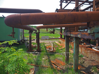 Rusty steampunk pipes on abandoned powerplant