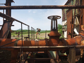 Rusty steampunk pipes on abandoned powerplant