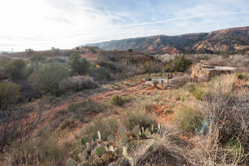 Full color wide landscape view of the scenic canyons and desert scenery while exploring Palo Duro Canyon on a trip west