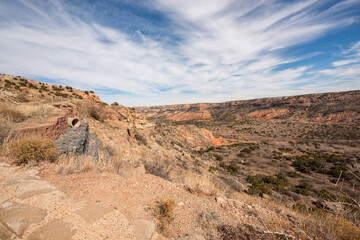 Full color wide landscape view of the scenic canyons and desert scenery while exploring Palo Duro Canyon on a trip west