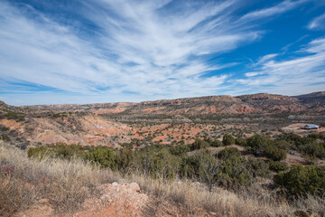 Full color wide landscape view of the scenic canyons and desert scenery while exploring Palo Duro Canyon on a trip west