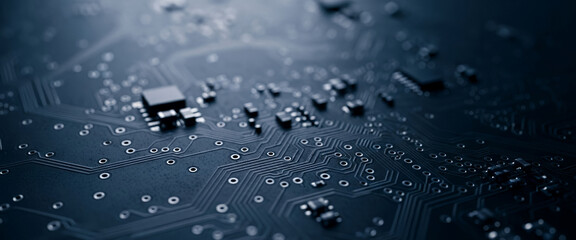 Close-up of a dark blue circuit board with electronic components visible, highlighting precise hardware layout used in advanced computing and embedded systems