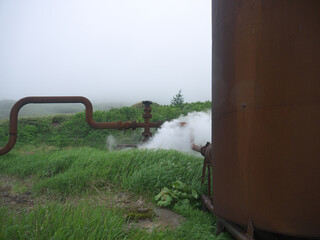 Steam leak jet blows from Rusty pipes 