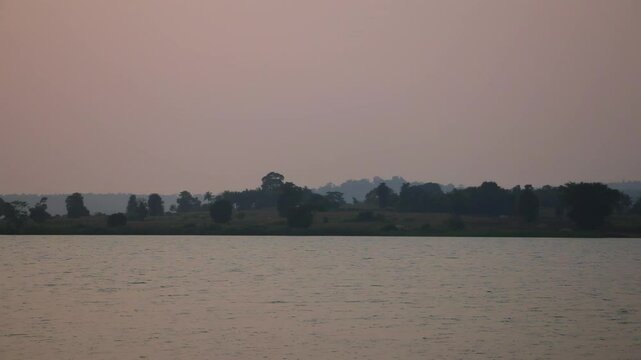 Evening calm over forest resort view across Kabini River in Nagarahole at sunset