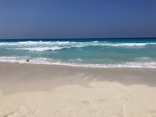 bright blue sky with beautiful calm ocean waves