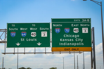 Midwest travel design element. Highway signs for Kansas City, Chicago and Indianapolis. Passenger view of exit signs.