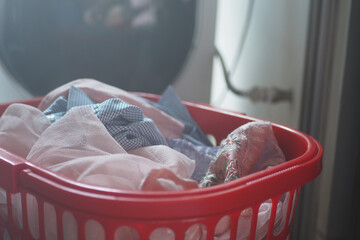 Laundry basket filled with clean clothes at home