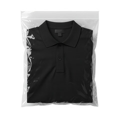 A clean black polo shirt neatly folded and sealed in a clear plastic bag isolated on transparent background