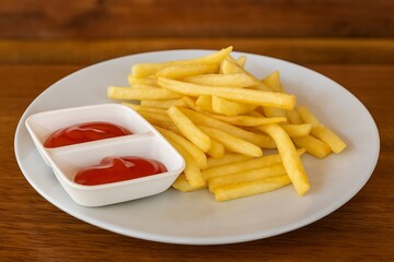 Delicious French Fries with Ketchup on White Plate