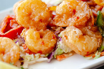  Fried Shrimp Served on a Platter with Lemon and Vegetables