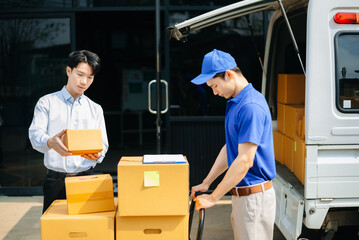Delivery Asian man by sending box of parcel to customers service at home