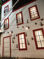 High walls with several glass windows. Textured Backgrounds. House walls with six rectangular windows decorating the walls. Exterior design and decoration. Unique house design with copy space.