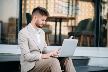 Businessman standing outdoors and using digital tablet. Perfect for corporate, technology, and professional themes