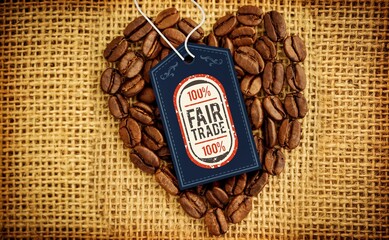 Quality tag over heart shape coffee beans