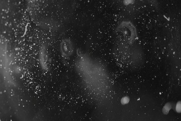 Monochrome flat design is showing countless white specks and smudges on pitch-black panel