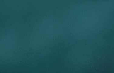 Uniform teal textured surface is filling entire flat design background, copy space
