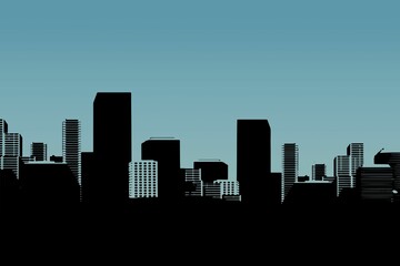 Silhouette cityscape against clear blue sky