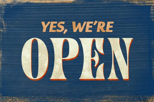 Fototapeta Vintage retro open sign is hanging on flat blue wooden plank background, showing bold serif text