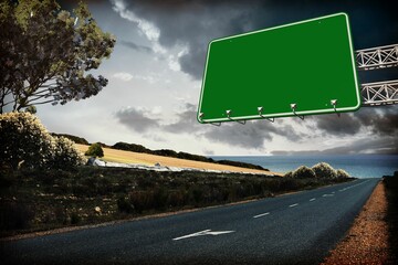Blank green highway sign is hanging from metal truss above rural coastal road in flat design