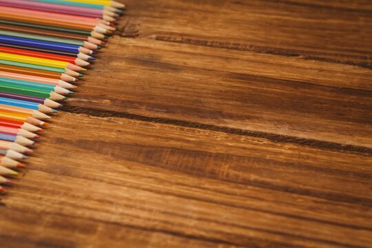 Color pencils on wooden table