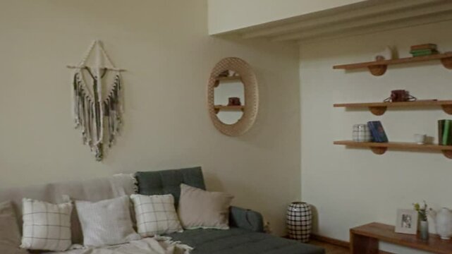 UGC of young African American woman talking on camera while vlogging in cozy living room, copy space