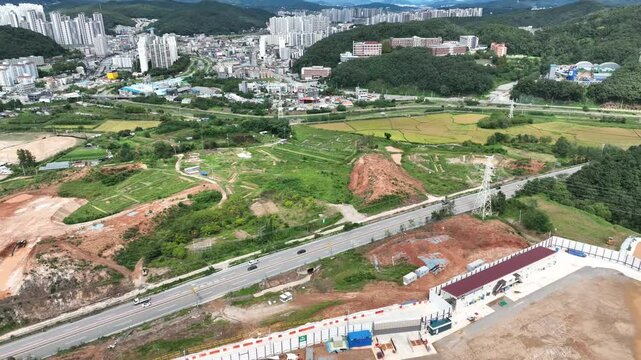 Drone Shot of City Edge with Ongoing Land Development and Agricultural Fields
