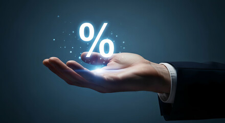 A businessman's hand presents a glowing percentage symbol, representing finance, investment, growth, and special offers in a modern and professional context.
