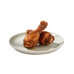 Two golden brown crispy fried chicken drumsticks served on a white plate isolated on transparent background
