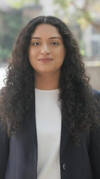 Vertical Video of Curly Hair Indian Businesswoman Doing Adab