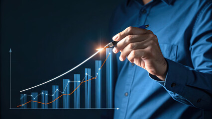 Businessman analyzing growth chart with pen, showcasing progress and success. 2026