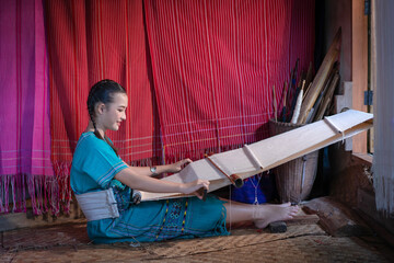 Beautiful Young Woman Learning Traditional Karen Weaving in Chiang Mai, Thailand