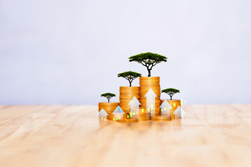 Stacks of coins with trees and upward arrows, symbolizing sustainable financial growth, green investments, and long-term wealth building.