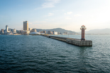 View of Takamatsu Port and the lighthouse from the sea at sunset