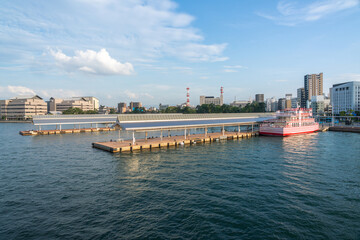 View of Takamatsu Port and the lighthouse from the sea at sunset