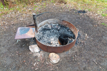 Photograph of a purpose built steel ringed campground fire pit to ensure safe  use for heating and...