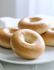 Bagel served on a clean white plate. close-up