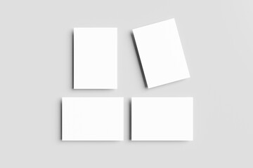 A4, A3, A5 paper 3D mockups or blank white business cards neatly arranged (horizontally & vertically) isolated on a grey background. Clean and minimalist, for branding or design presentations