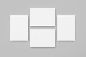 Fototapeta premium White A4 paper, magazine, or business card mockups floating diagonally with soft shadows isolated on grey background.