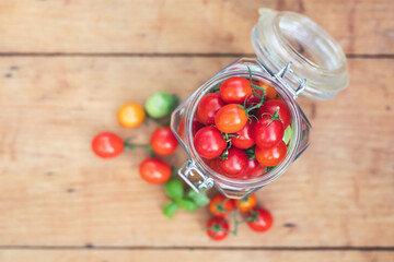 Preserved tomatoes in jar - top view.