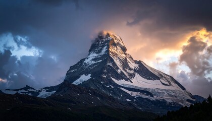 Dramatic mountain peak shrouded by stormy clouds