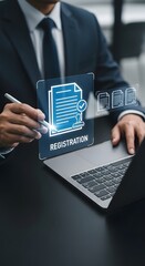 A businessman is preparing a registration document using a digital application on his laptop, showcasing modern business technology and legal processes.