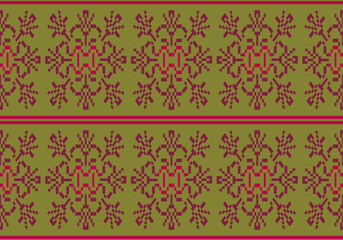 This pixel-style fabric pattern features symmetrical maroon and red floral motifs on an olive green background. The design repeats horizontally with traditional, handcrafted textile aesthetics.