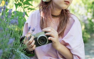 Young photographer capturing nature with vintage camera